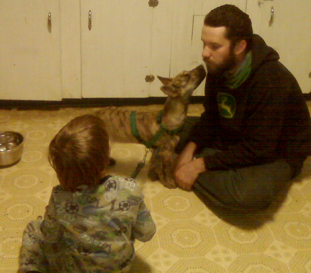 First night after we brought him home, he's giving my fiancee, Jon, kisses.